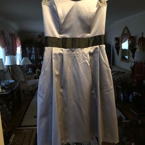 Tea length gray satin dress with black belt